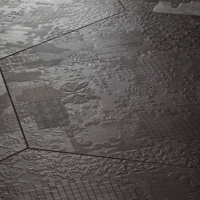 detail of artisan ceramic mosaic with natural tonal variations in a commercial lobby