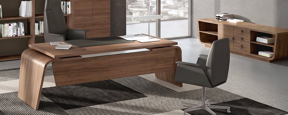 Desk with integrated pedestal